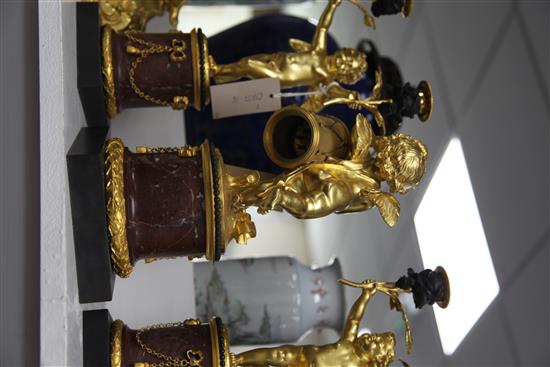 A French ormolu and rouge marble clock garniture, candelabra 13.25in.